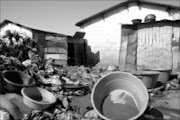 MINING MATERIALS: Basins and metal sheets from part of equipment illegal miners use to refine gild dust at G-hostel in Thabong, Welkom. Pic. Siphiwe Malaza. 11/10/2007. © Sowetan.