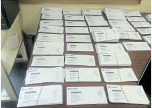 Boxes of receipts for the purchase of fuel for municipal vehicles which be manually added to an Excel document