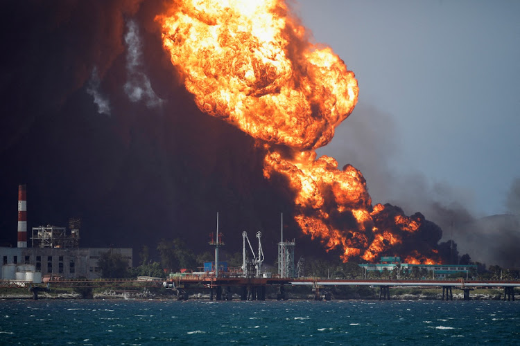 A fire at fuel storage tanks near Cuba’s Matanzas port, Cuba, August 8 2022. Picture: ALEXANDRE MENEGHINI/REUTERS