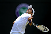 Novak Djokovic of Serbia serves during his second round match against Kevin Anderson of South Africa on Day Four of the Wimbledon Lawn Tennis Championships at the All England Lawn Tennis and Croquet Club on June 23, 2011 in London, England