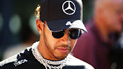 Lewis Hamilton of Great Britain and Mercedes GP walks in the Paddock during previews ahead of the F1 Grand Prix of Australia at Melbourne Grand Prix Circuit on March 12, 2020 in Melbourne, Australia.