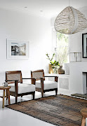 All-white paint allows the furniture to pop in the upstairs living room. 