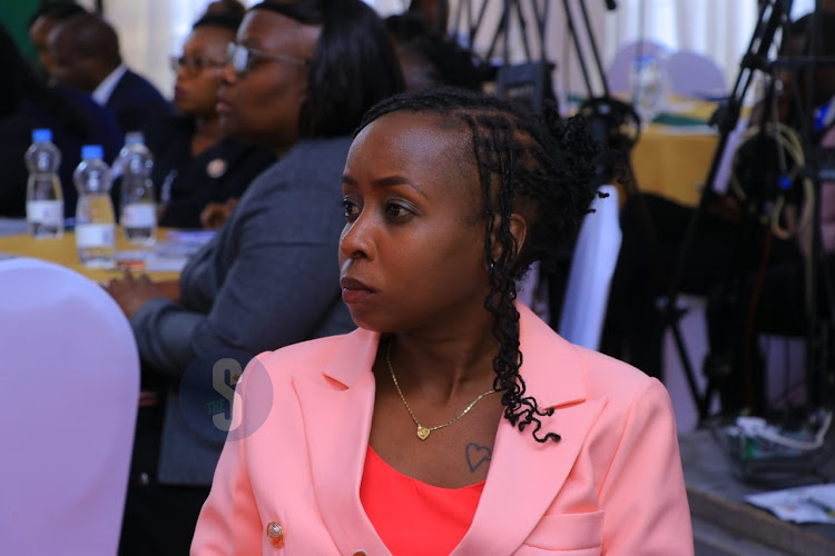 Newly appointed head of communications at the Ministry of Public Service, Performance and Delivery Management, Jacque Maribe follows the proceedings of the of the launch of e-filling in all courts countrywide at the Supreme Court of Kenya on March 11, 2024.