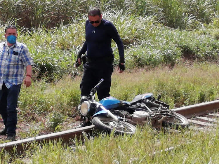 A motorcycle lies at the site where the body of journalist Julio Valdivia was found in Tezonapa, Veracruz, Mexico on Wednesday.