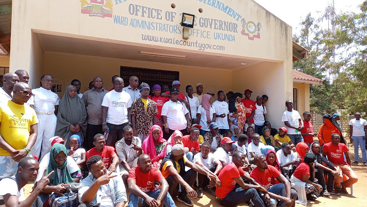 Rights activists, government security agencies and Kwale youth in a group photo at Ukunda showground on Saturday