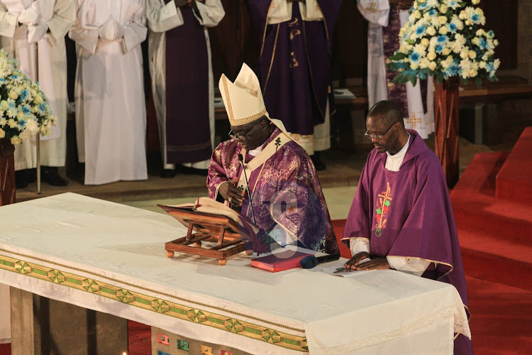 Archbishop Philip Anyolo with Consolata Father incharge Jackson Murugaru leading the requiem mass of the former Education CS Prof George Magoha at Consolata Shrine in Nairobi, on February 9, 2023.