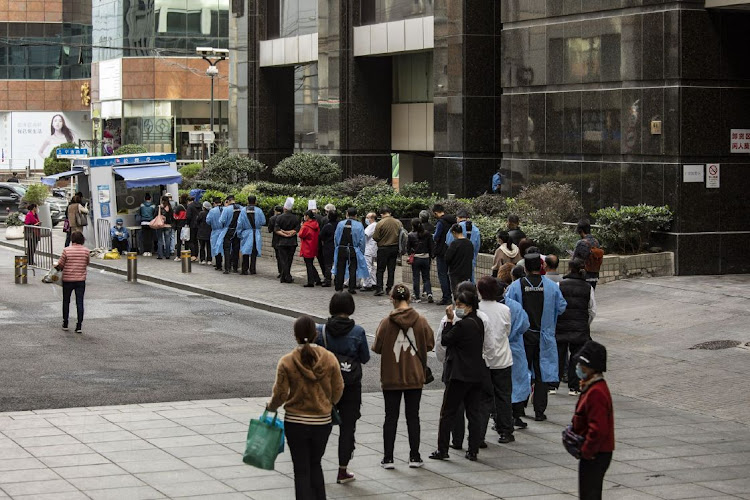 Residents queue at a Covid-19 testing station in Shanghai, China, on Sunday November 6 2022. Picture: BLOOMBERG/QILAI SHEN