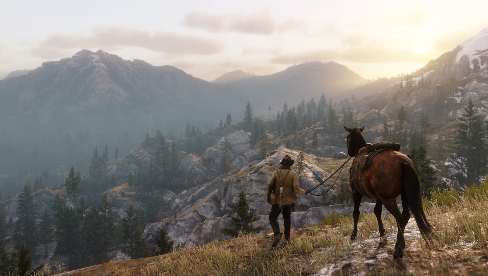 Arthur Morgan next to his horse on a mountain range in Red Dead Redemption 2