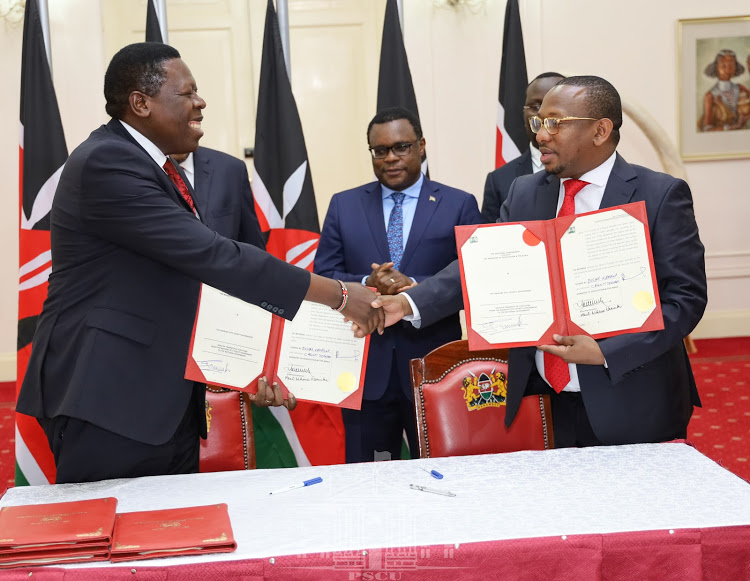 Devolution CS Eugene Wamalwa and Nairobi Governor Mike Sonko shake hands after they signed the agreement at State House, Nairobi on February 25, 2020. Image: