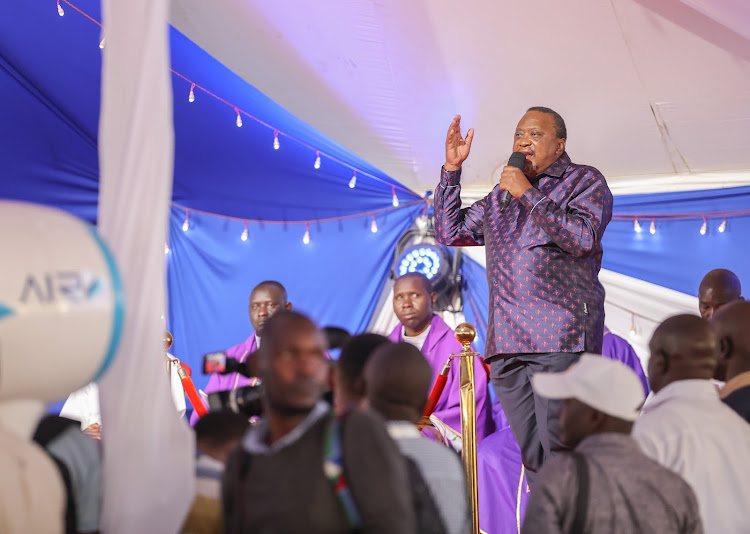 Former President Uhuru Kenyatta addressing mourners at Odera Akang’o University for the burial of former Education CS George Magoha on February 11, 2023.