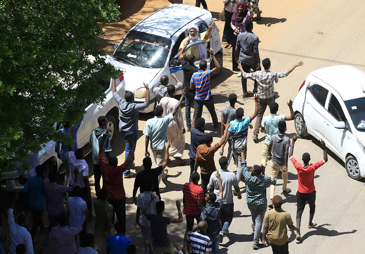 Sudanese demonstrators chant slogans during a protest demanding Sudanese President Omar Al-Bashir to step down in Khartoum, Sudan, on April 6