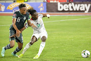 Samuel Chukwueze of Nigeria challenges Gideon Mensah of Ghana in the Qatar 2022 Fifa World Cup qualifier at the Baba Yara Stadium in Kumasi, Ghana on March 25 2022.