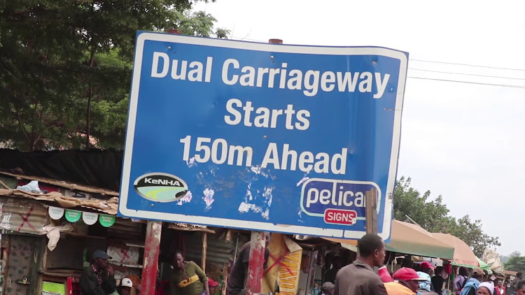 A sign post by Kenha indicating where the dual carriageway will start in Kenol town