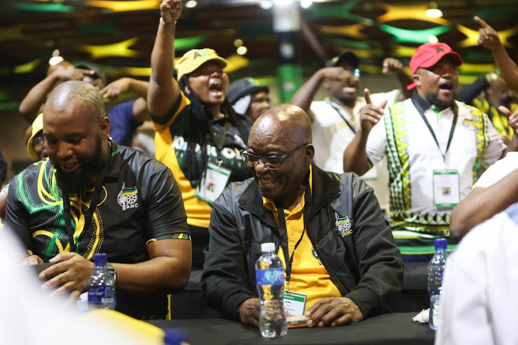 ANC KwaZulu-Natal provincial chair Siboniso Duma, right, and former president Jacob Zuma seated as delegates chant behind them at Nasrac. Picture: ALAISTER RUSSELL/SUNDAY TIMES