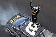 Tyler Reddick celebrates after winning the NASCAR Cup Series Verizon 200 at the Brickyard at Indianapolis Motor Speedway on July 31 2022 in Indiana.