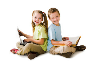 Smart girl with laptop and cute schoolboy with book sitting back to back and looking at camera