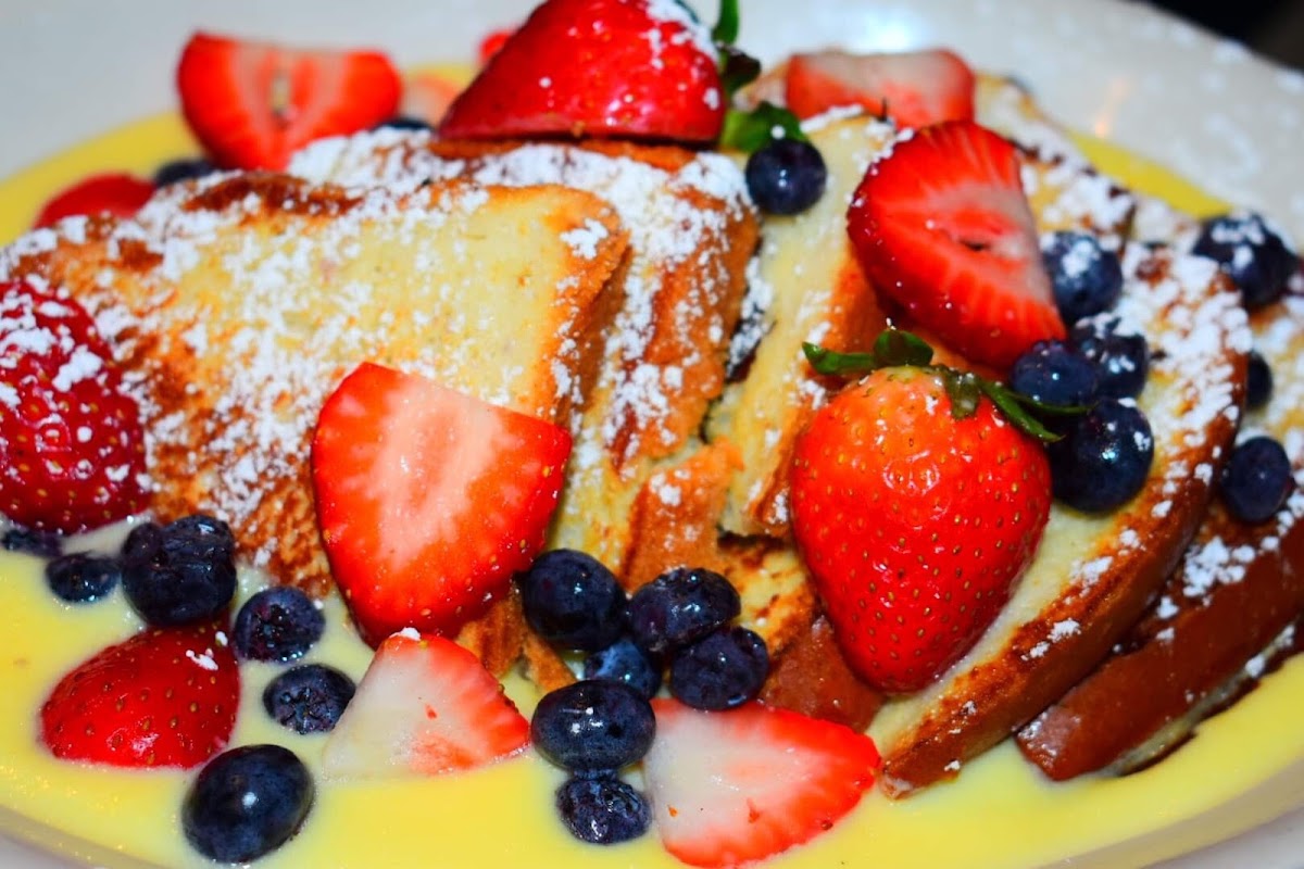 On f our special #gluten free custard French toast with delicious fresh berries