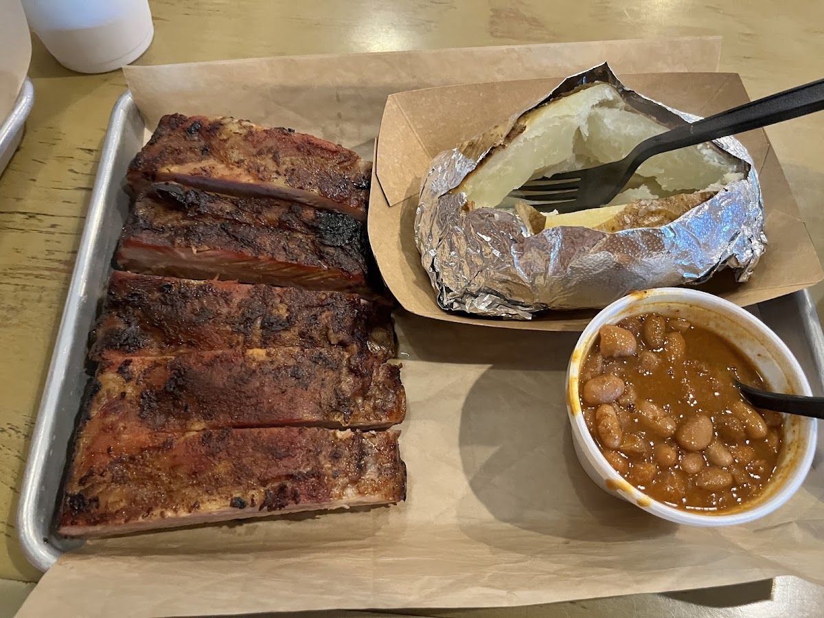 Ribs (no BBQ), plain baked potato, and baked pinto beans.