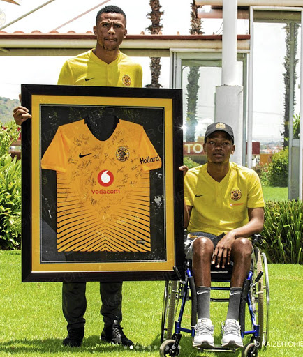 Wiseman Meyiwa, in wheelchair, with Kaizer Chiefs teammate Siyabonga Ngezana.