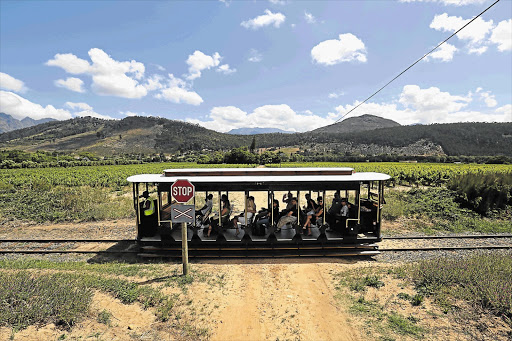 WINE DOWN: The tram meanders through vineyards