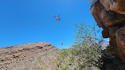 The hiker is airlifted after being rescued.