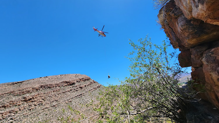 The hiker is airlifted after being rescued.