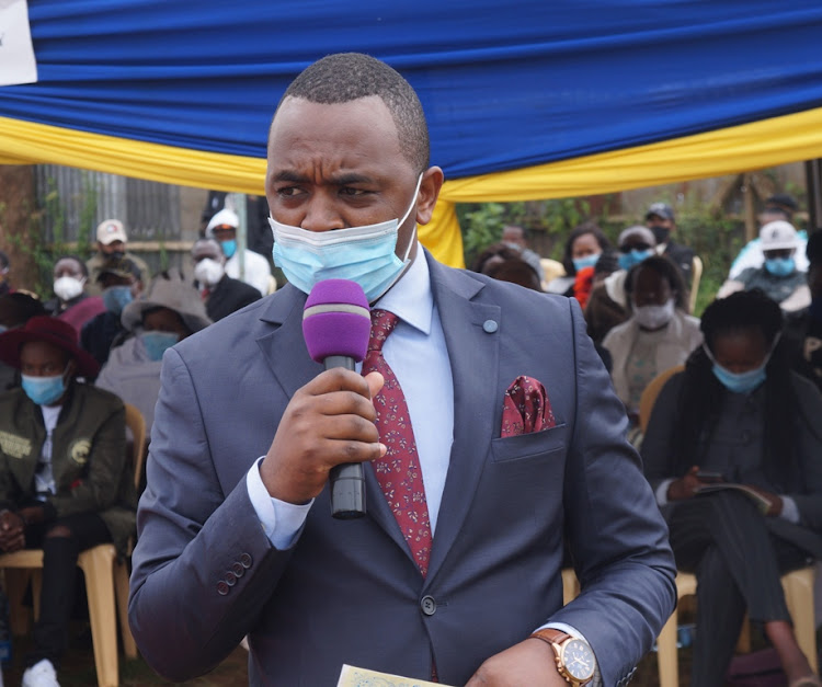 Lari Kirenga MCA Joseph Karichu speaks at the public participation event at Nyambare trading centre on Tuesday.