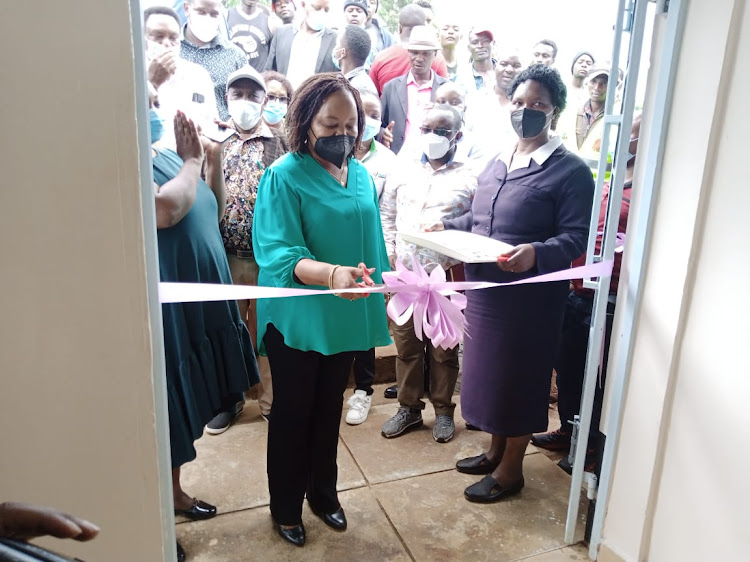 Kirinyaga governor Ann Waiguru cuts a ribbon as she officially opens the Kamwana dispensary in Gichugu, Kirinyaga county.