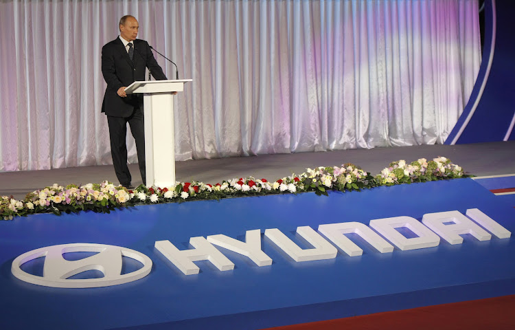 Russian President Vladimir Putin speaks during the opening ceremony of a Hyundai plant in St.Petersburg in 2010.