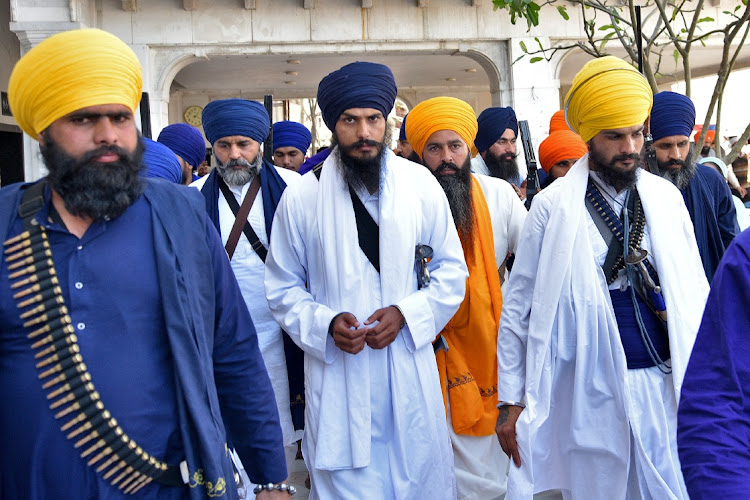 Amritpal Singh, a radical Sikh leader, leaves the holy Sikh shrine of the Golden Temple along with his supporters, in Amritsar, India, March 3, 2023.