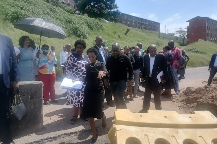 Acting public protector Kholeka Gcaleka and members of the KwaZulu-Natal legislature visit the Glebelands hostel in Umlazi, south of Durban.