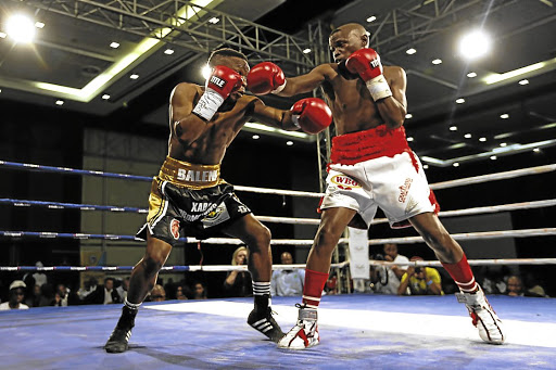 Nkosinathi Joyi, right, in action against Siphamandla Baleni. Joyi will fight Joy Canoy of the Philippines on December 16.