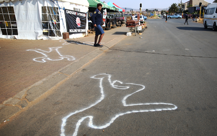 Residents of Eldorado Park, fed up with violent crime, have set up tents outside the police station and painted body outlines on the road as part of their campaign for action against gangsters. File photo.