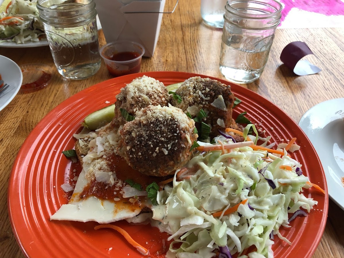 Meatball Diavolo Angus, veal, and pork meatballs, marinara, imported provolone, parmesan cheese, hot cherry peppers, on GF bread