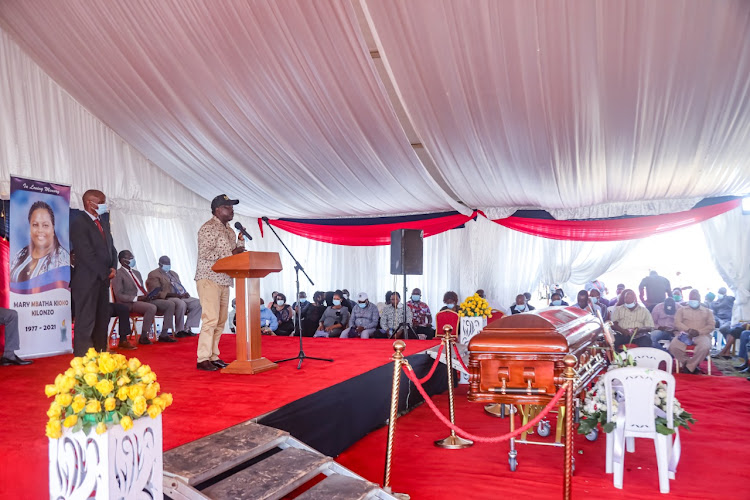 Yatta MP Charles Kilonzo (in suit) during her sister-in-law's burial at at Ndalani village in Yatta constituency, Machakos County on Saturday, February 27.