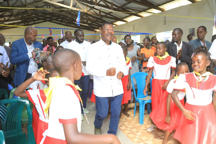 National Assembly Speaker Moses Wetang'ula interacting with congregants during a service at St. Stephen's Sikusi Catholic Church on December 26, 2023.