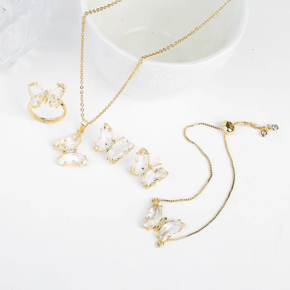 Colar de cristal da sorte Borboleta, conjunto de quatro peças, com cores vibrantes. Leve a beleza e sorte em seu dia a dia com este colar.