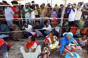 Ethiopians who fled the ongoing fighting in Tigray region gather to receive relief aid at the Um-Rakoba camp on the Sudan-Ethiopia border, in Kassala state in December.