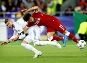 Sergio Ramos of Real Madrid challenges Liverpool's Mohamed Salah in the Uefa Champions League final at NSC Olimpiyskiy Stadium in Kyiv, Ukraine in May 2018.