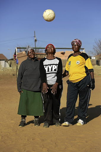 Caroline Ndlovu, Jabulile Mthethwa and Georgina Shilenge, members of the Phefeni Gogos, during a training session at their home ground in Soweto.