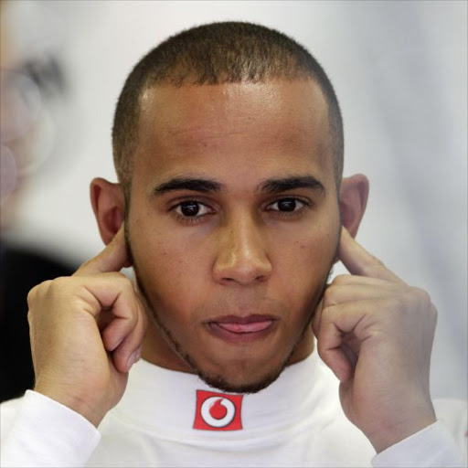 McLaren Formula One driver Lewis Hamilton of Britain cups his ears during the first free practice session of European F1 Grand Prix in Valencia June 24, 2011