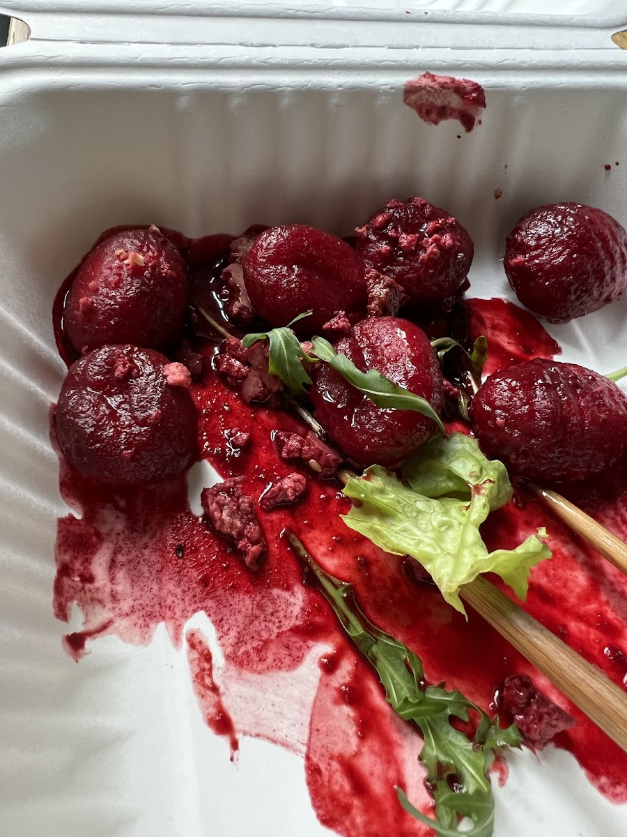 A photo of my leftovers (beet gnocchi) -- i demolished it in restaurant.