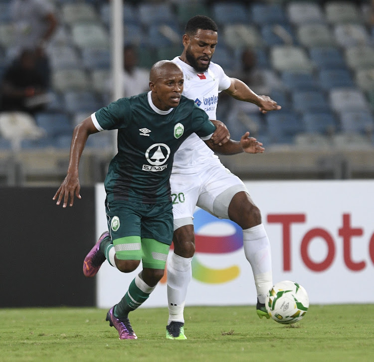 Luvuyo Memela of AmaZulu challenged by Abdeljalil Jbira of Raja Casablanca during their CAF Champions League clash Moses Mabhida Stadium.