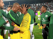 Bafana Bafana players Tiyani Mabunda and Percy Tau celebrate after their win over  Lybia in Tunisia on Sunday night./Safa TWITTER