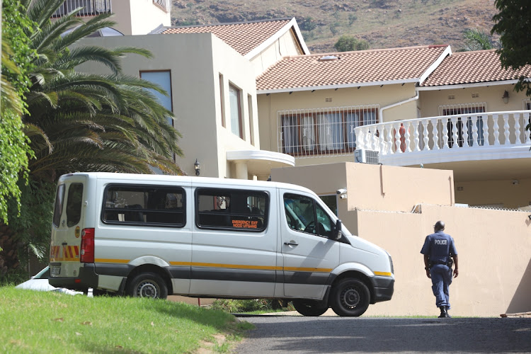 An officer stands guard outside speaker Nosiviwe Mapisa-Nqakula's home in Bruma.