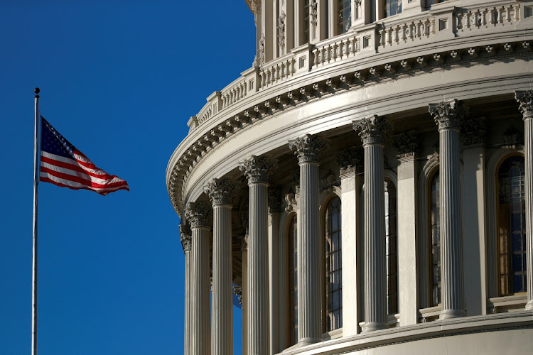 An American flag flies outside of the US Capitol dome in Washington, the US. Picture: REUTERS/TOM BRENNER