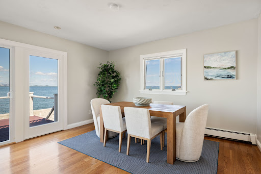 Dining room with sea view and wooden table - Prestige property for sale in Quincy, 4 bedrooms
