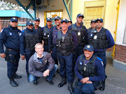 City of Cape Town mayoral committee member for safety and security JP Smith with members of the rail enforcement unit at Athlone station on September 18 2019.