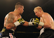 Kevin Lerena of SA (Black & Gold trunk) fighting Dmytro Kucher of Ukrain (Black trunk) in the IBO world cruser weight title during the Palace Pandemonium boxing event at Emporers Palace on March 03, 2018 in Johannesburg, South Africa. 