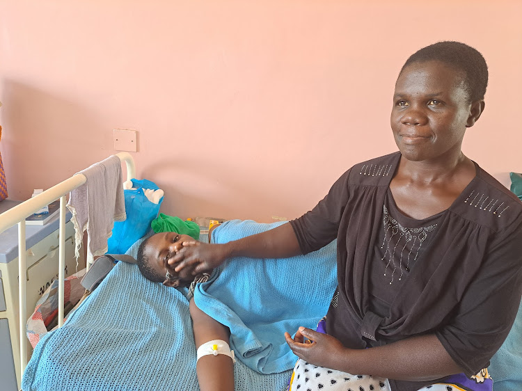 Agnes Indechi with her mother Dorice Kadima at the Jaramogi Oginga Odinga Teaching and Referral Hospital awaiting surgery.